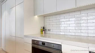 Dainty Wilder, Housewife Using Large Toy on Kitchen Counter